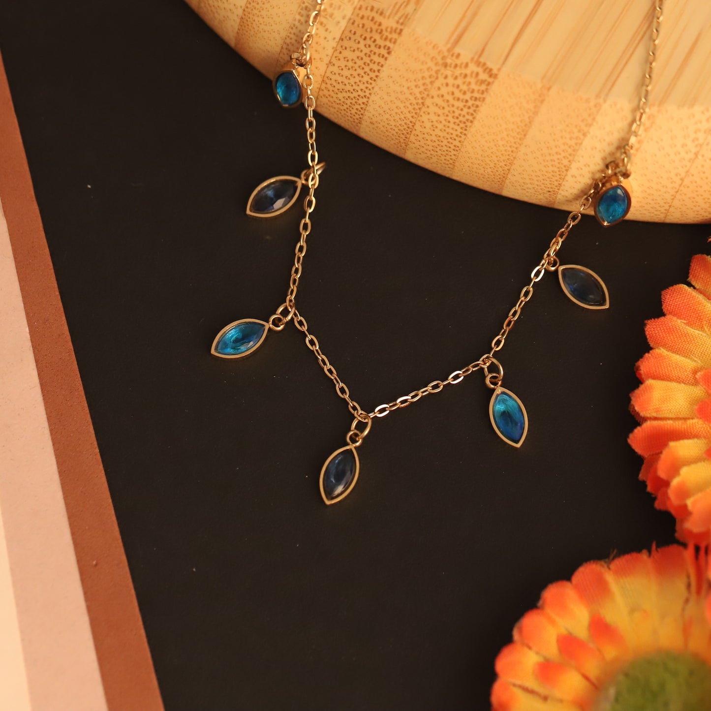 Gold Tone Dangle Gemstone Tanmaniya | Teardrop Blue Crystal Pendant | Delicate Layering Jewellery