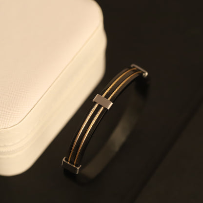 Modern Black and Gold Wire Bracelet - Sleek, Minimalist, and Stylish.