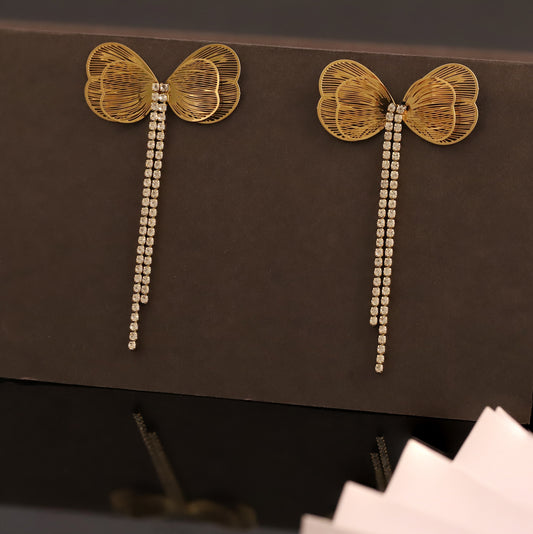 Golden Bow Stud Earrings with Cascading Cubic Zirconia Chains - Glamorous Women's Jewelry