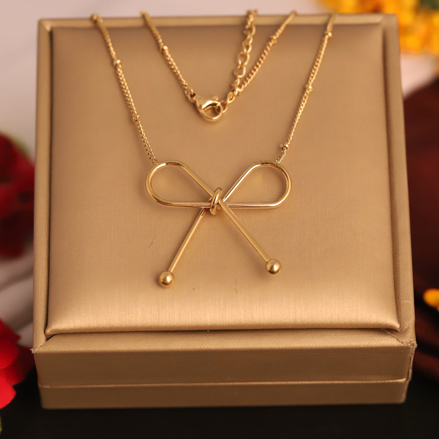 Chic Gold Bow Knot Chain Pendant- Stainless Steel | Dainty & Modern Ribbon Jewelry