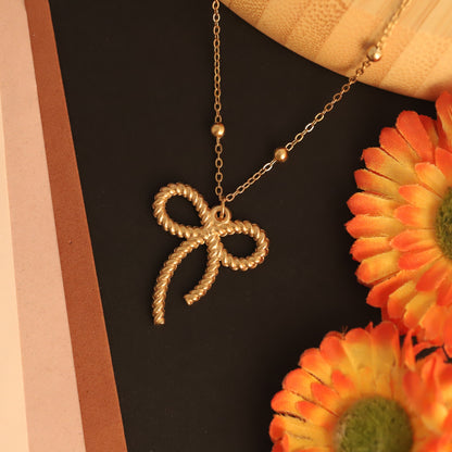 Textured Rope Bow Pendant Necklace | Gold Beaded Jewelry
