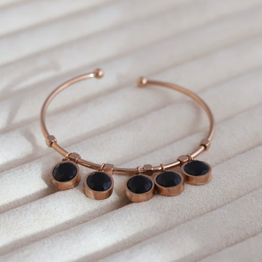 Sleek Rose Gold Plated Kada Bracelet with Black Stone Charms