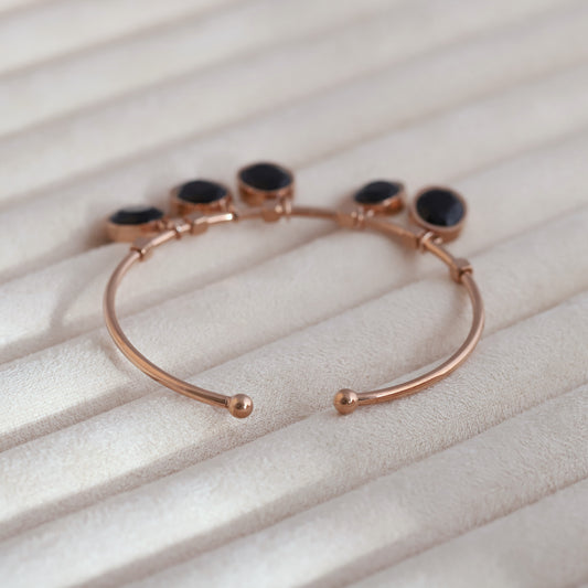 Sleek Rose Gold Plated Kada Bracelet with Black Stone Charms