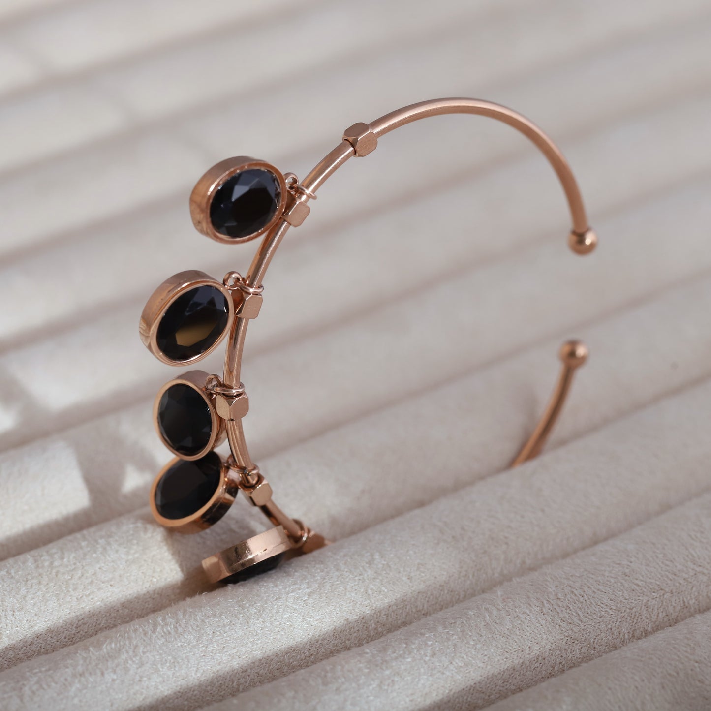 Sleek Rose Gold Plated Kada Bracelet with Black Stone Charms
