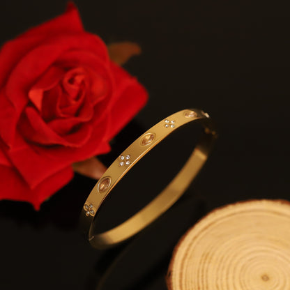Elegant Gold Bangle with Oval Topaz and Crystal Clover Accents | Chic Charm Bracelet