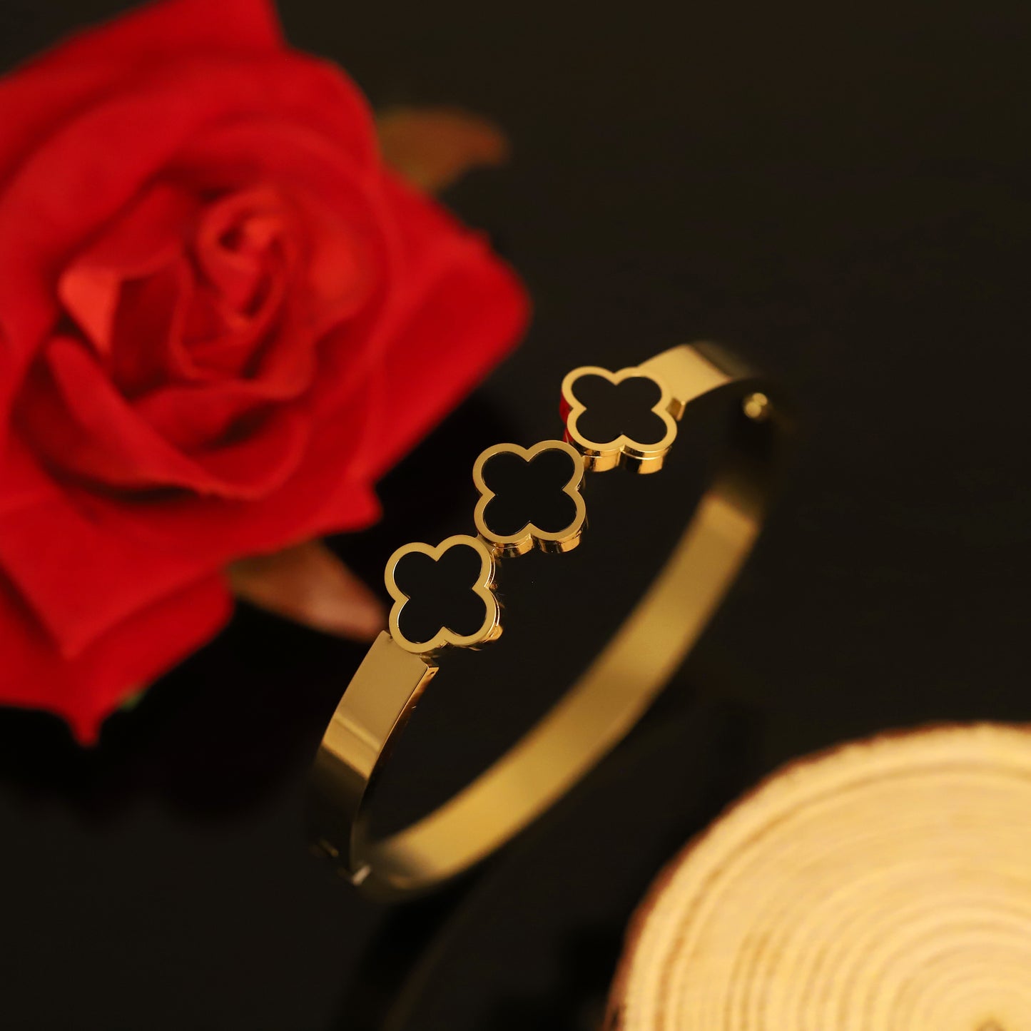Chic Gold Bangle with Black Clover Charms | Minimalist Statement Bracelet for Women