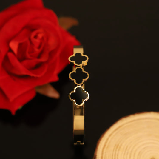 Chic Gold Bangle with Black Clover Charms | Minimalist Statement Bracelet for Women