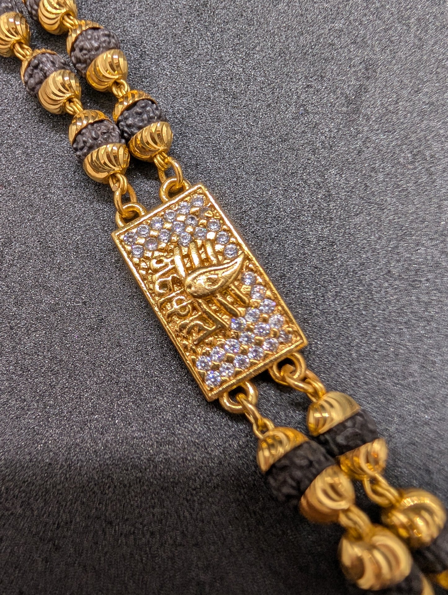 Gold & Rudraksha Beaded Bracelet with Diamond-Studded Spiritual Motif