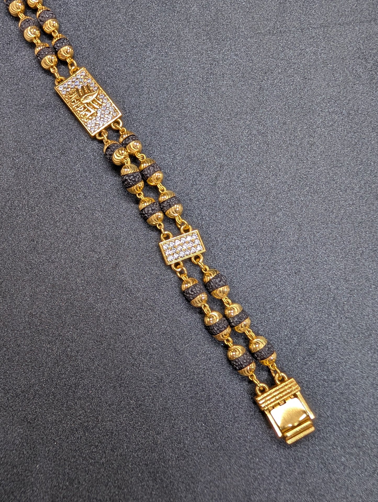 Gold & Rudraksha Beaded Bracelet with Diamond-Studded Spiritual Motif