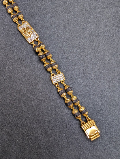 Gold & Rudraksha Beaded Bracelet with Diamond-Studded Spiritual Motif