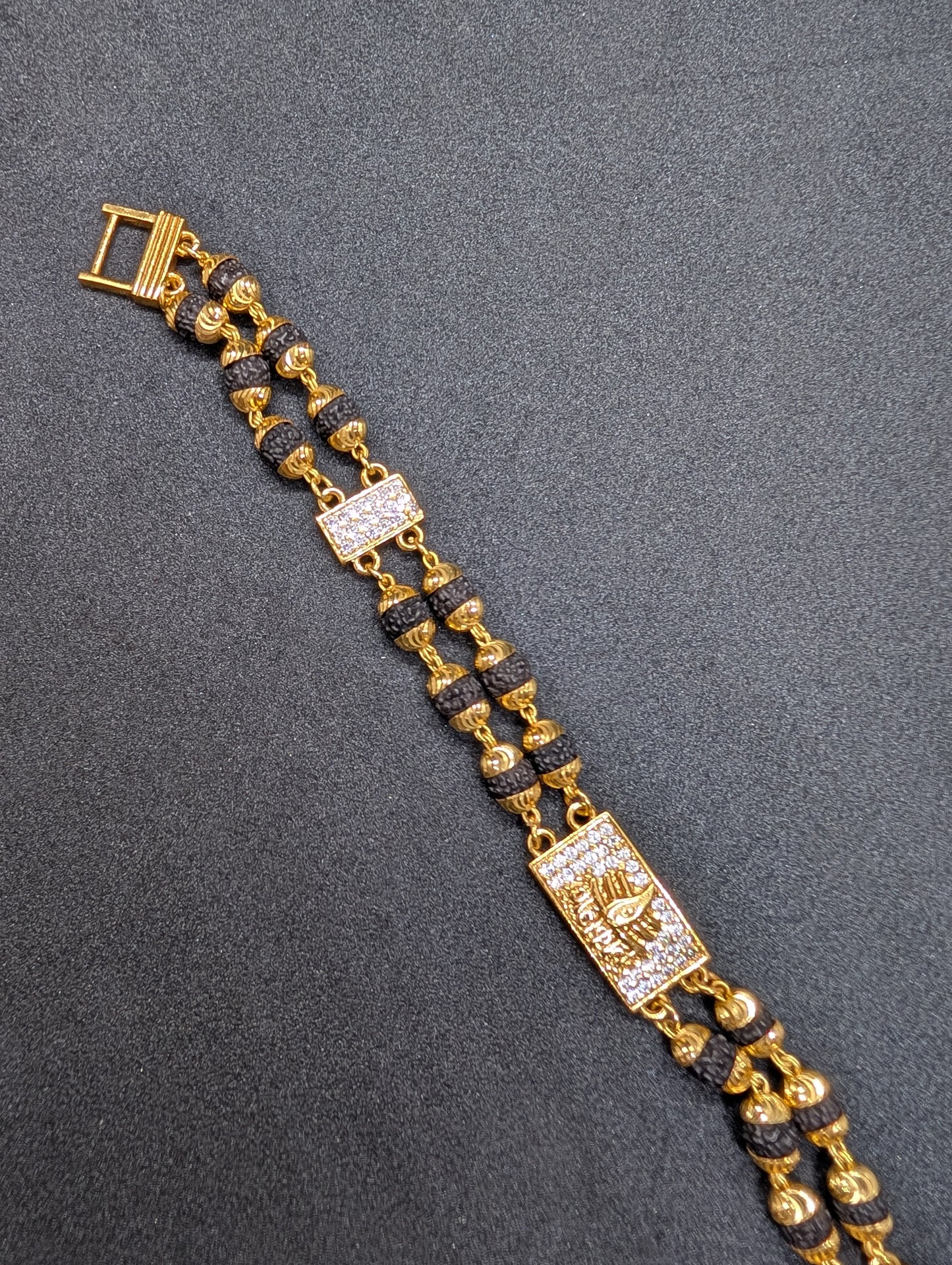 Gold & Rudraksha Beaded Bracelet with Diamond-Studded Spiritual Motif