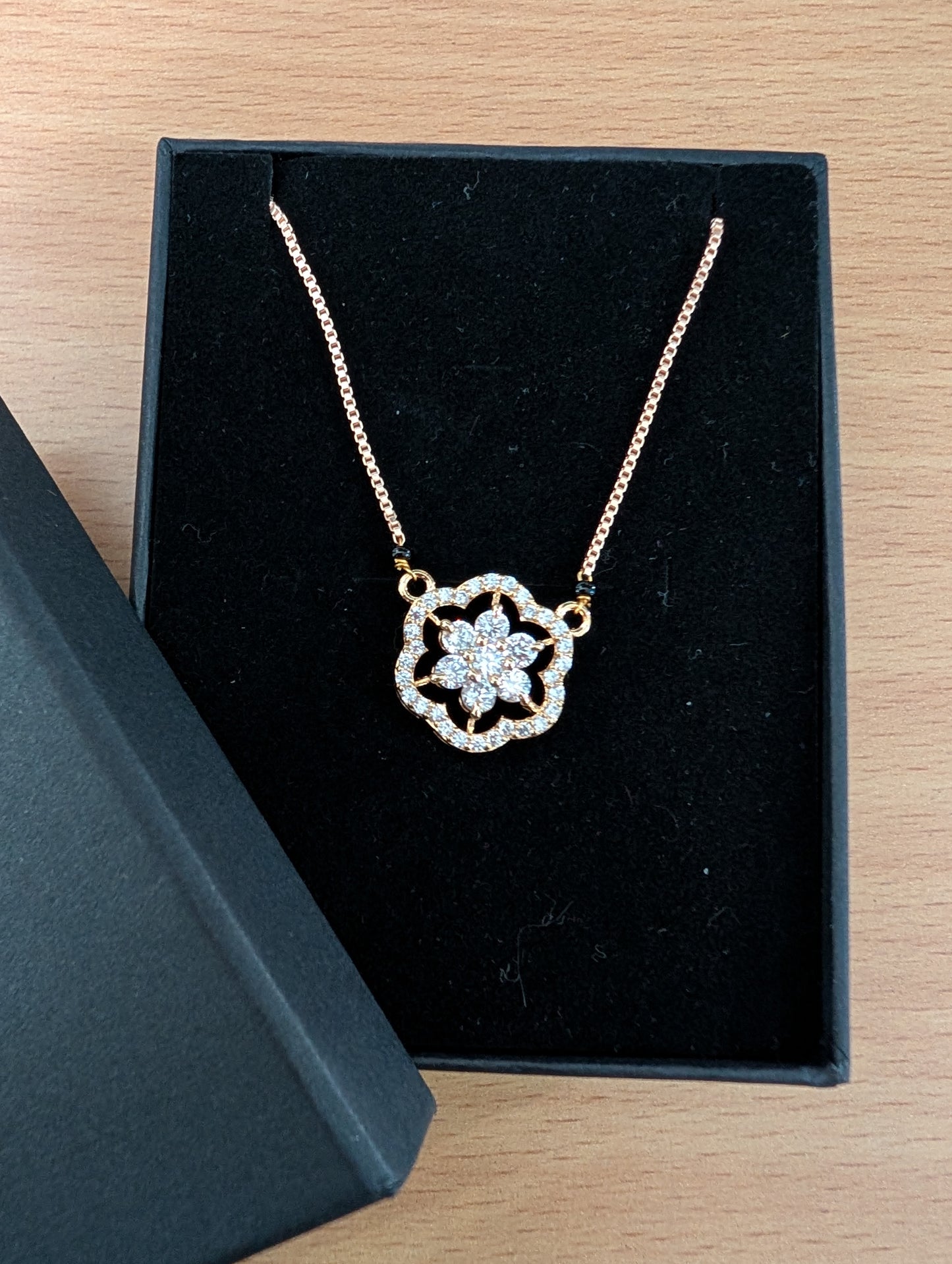 Elegant Diamond & Gold Mangalsutra: Traditional Black Bead Necklace with Modern Floral Pendant